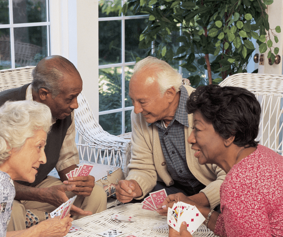 Senior citizens playing cards