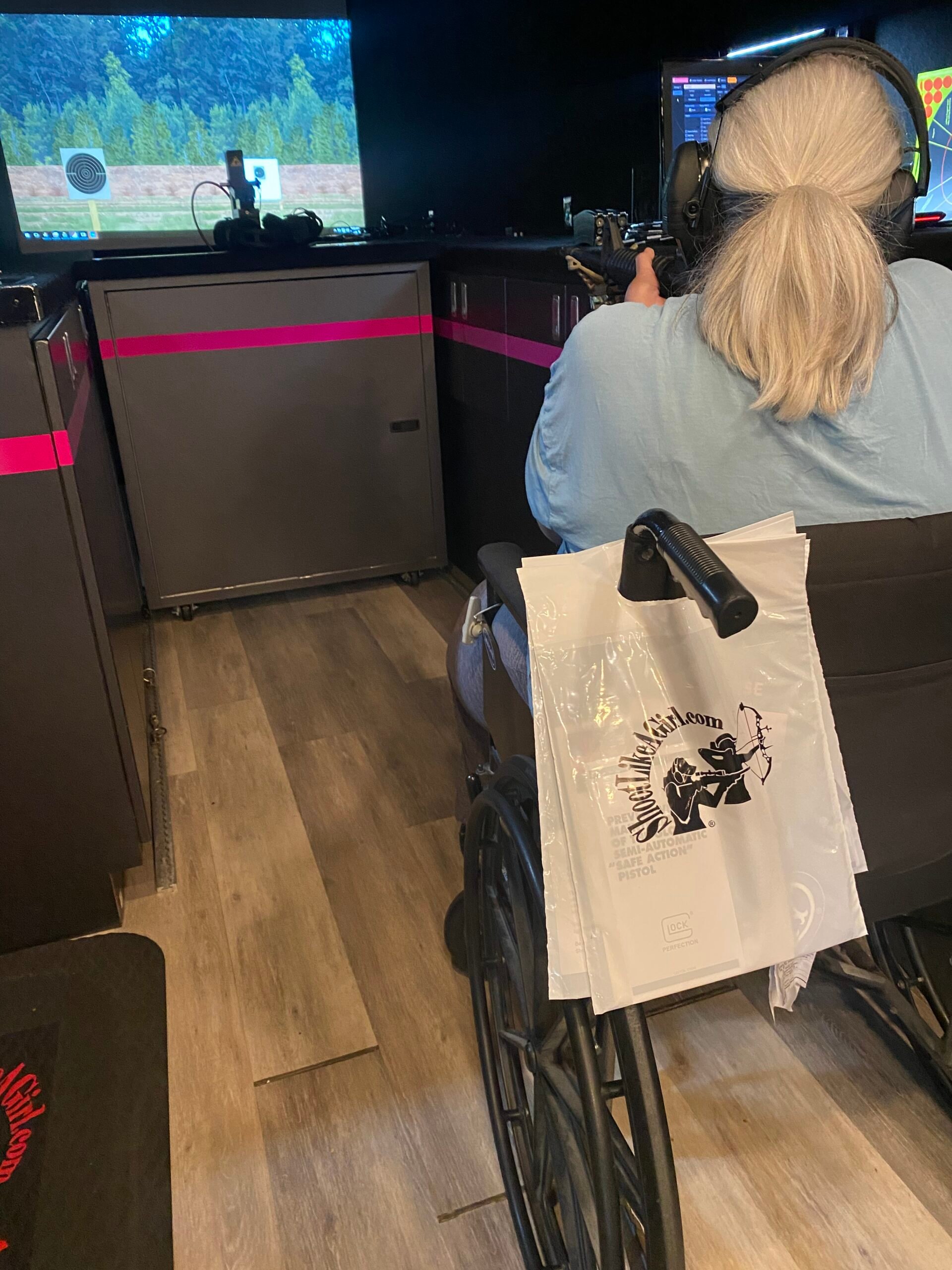 lady in wheelchair at Shoot Like A Girl event