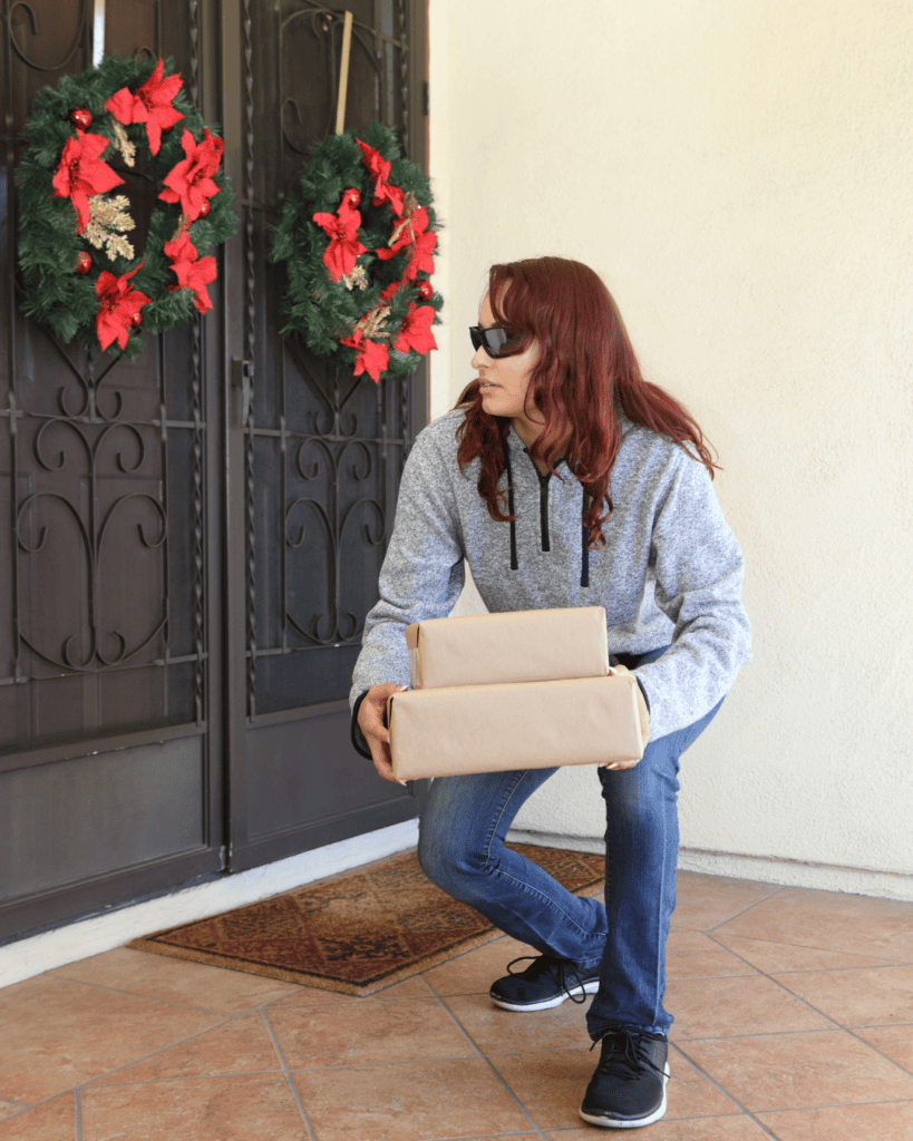 Woman stealing package from porch