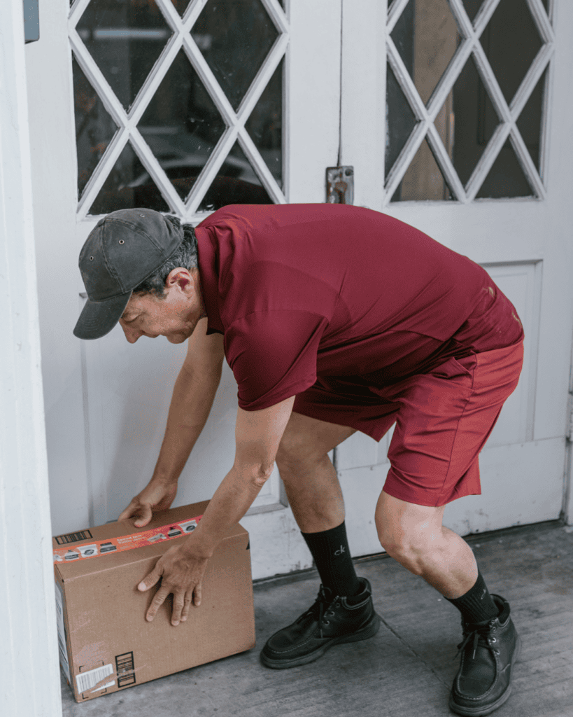Man stealing package from porch